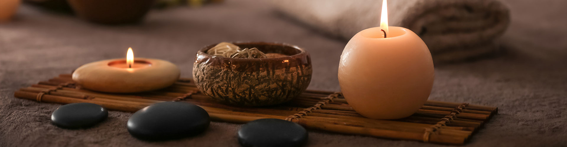 candles and bowl on bamboo bored